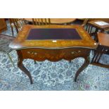 A 19th Century French marquetry inlaid mahogany and gilt metal mounted writing table