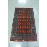 An eastern red ground rug, 160 x 95cms