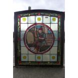 A 19th Century Flemish stained glass window, depicting a winemaker bottling wine, 80 x 67cms