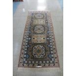 A Moroccan cream ground rug, 212 x 94cms