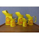 A set of five graduated Shell Oil advertising cans