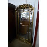 A large gilt French style gilt framed mirror with crest, 183 x 90cms (M32168) #