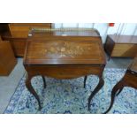 A 19th Century French marquetry inlaid rosewood and gilt metal mounted bureau de dame