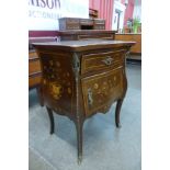 A 19th Century French marquetry inlaid mahogany and gilt metal mounted bombe shaped petit commode