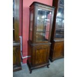 A George I style walnut two door display cabinet
