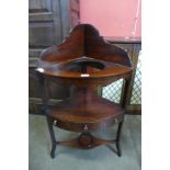 A George III inlaid mahogany corner washstand