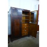 An Art Deco inlaid mahogany fitted compactum style wardrobe