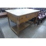 A pine two drawer farmhouse kitchen table