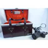 A Canon AE-1 camera with box and accessories including lenses, filters, etc.