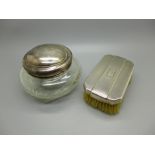 A silver topped cut glass pot, top dented, and an Art Deco silver backed brush