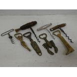 Eight brass bottle openers and vintage corkscrews