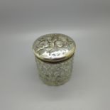 A silver topped cut glass jar decorated with Reynolds angels, Birmingham 1904