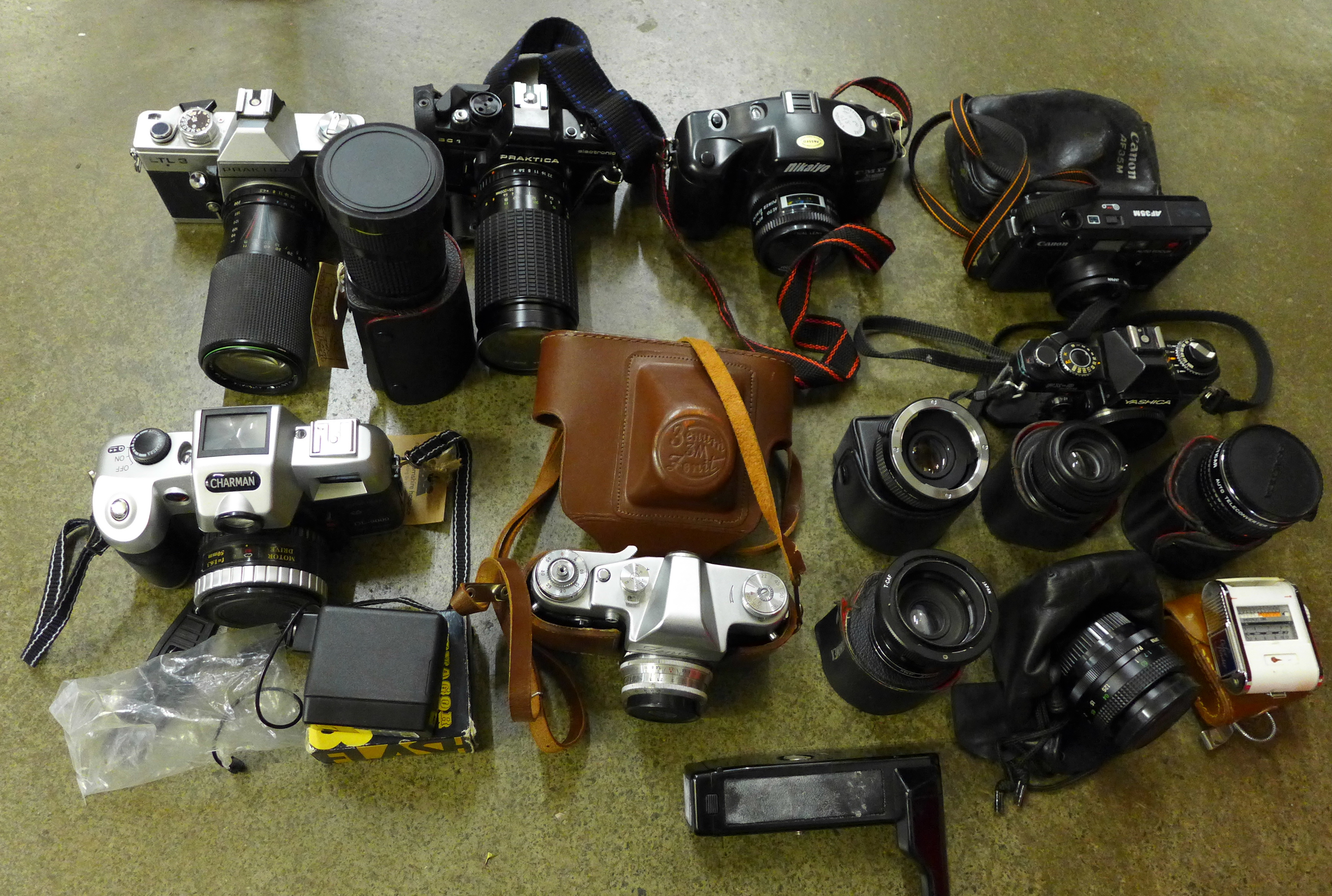 Assorted 35mm film cameras; Yashica, Praktica, Charman, Canon, etc.