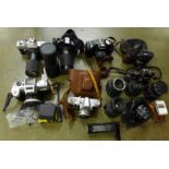 Assorted 35mm film cameras; Yashica, Praktica, Charman, Canon, etc.
