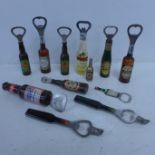 Twelve vintage novelty bottle openers