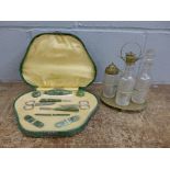 An Art Deco manicure set, cased, and a cruet set **PLEASE NOTE THIS LOT IS NOT ELIGIBLE FOR