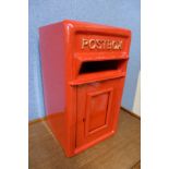 A painted red metal Post Office letter box, with key