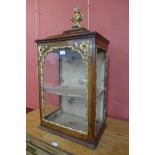 An 18th Century French stained pine and gilt gesso table top cabinet