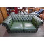 A green leather Chesterfield settee