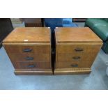 A pair of Art Deco style walnut three drawer chests