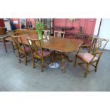 A George III style Ipswich oak pedestal dining table and six Chippendale style chairs Purchased in