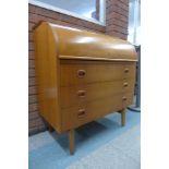 A Swedish SMI teak cylinder top desk, designed by Egon Ostergaard