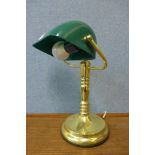 A brass student's desk lamp