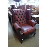 A red leather Chesterfield wingback armchair