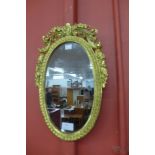 A small French style ormolu framed mirror