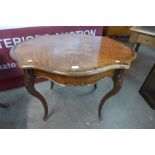 A 19th Century French burr yew and rosewood serpentine centre table