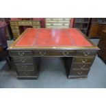 A George III style mahogany and red leather topped partners desk