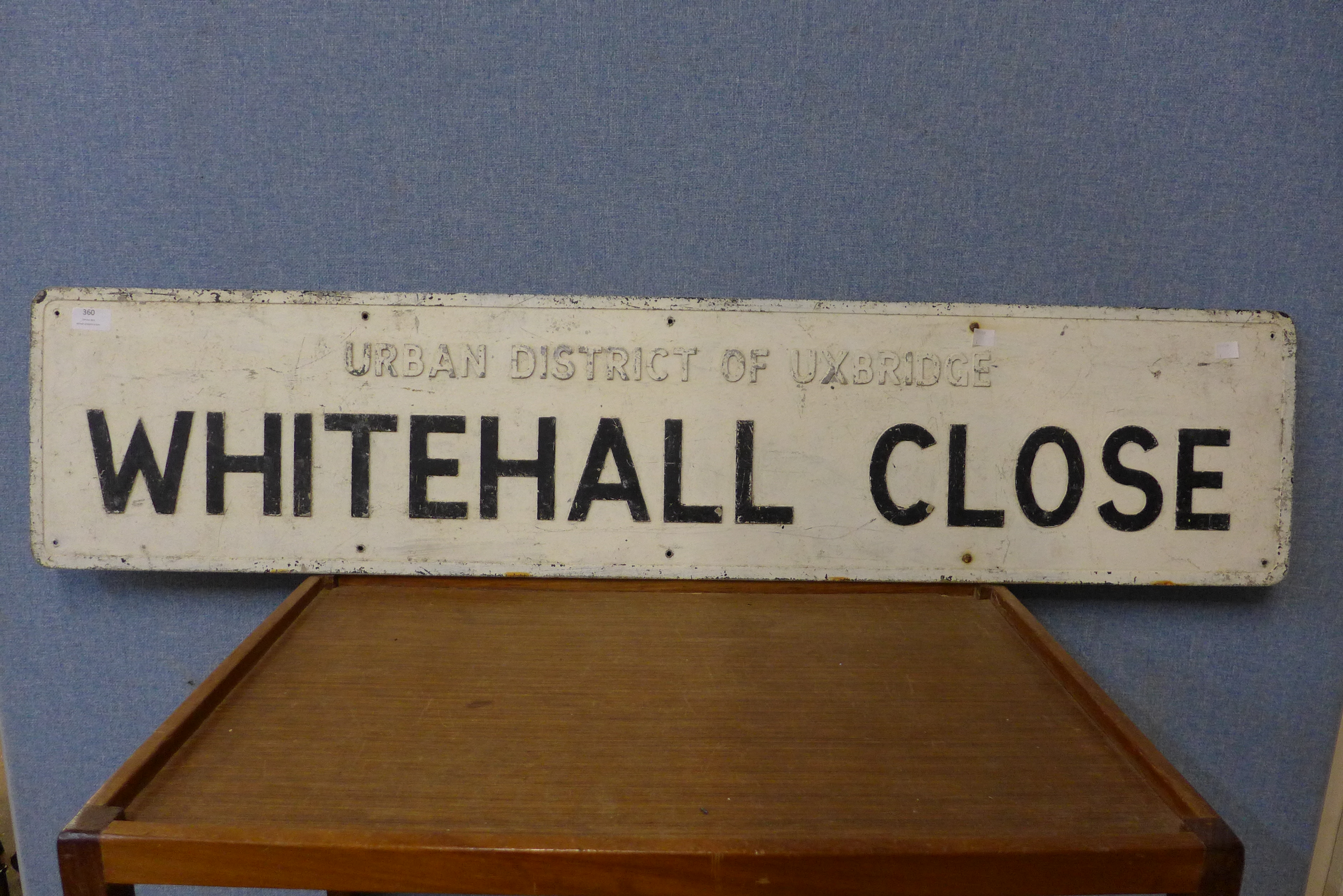 A Whitehall Close metal street sign