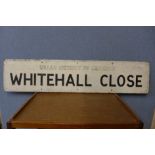 A Whitehall Close metal street sign