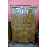 A George I style burr walnut serpentine tallboy