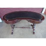 A Victorian style mahogany kidney shaped writing table