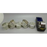 Eight silver napkin rings, one boxed, 161g