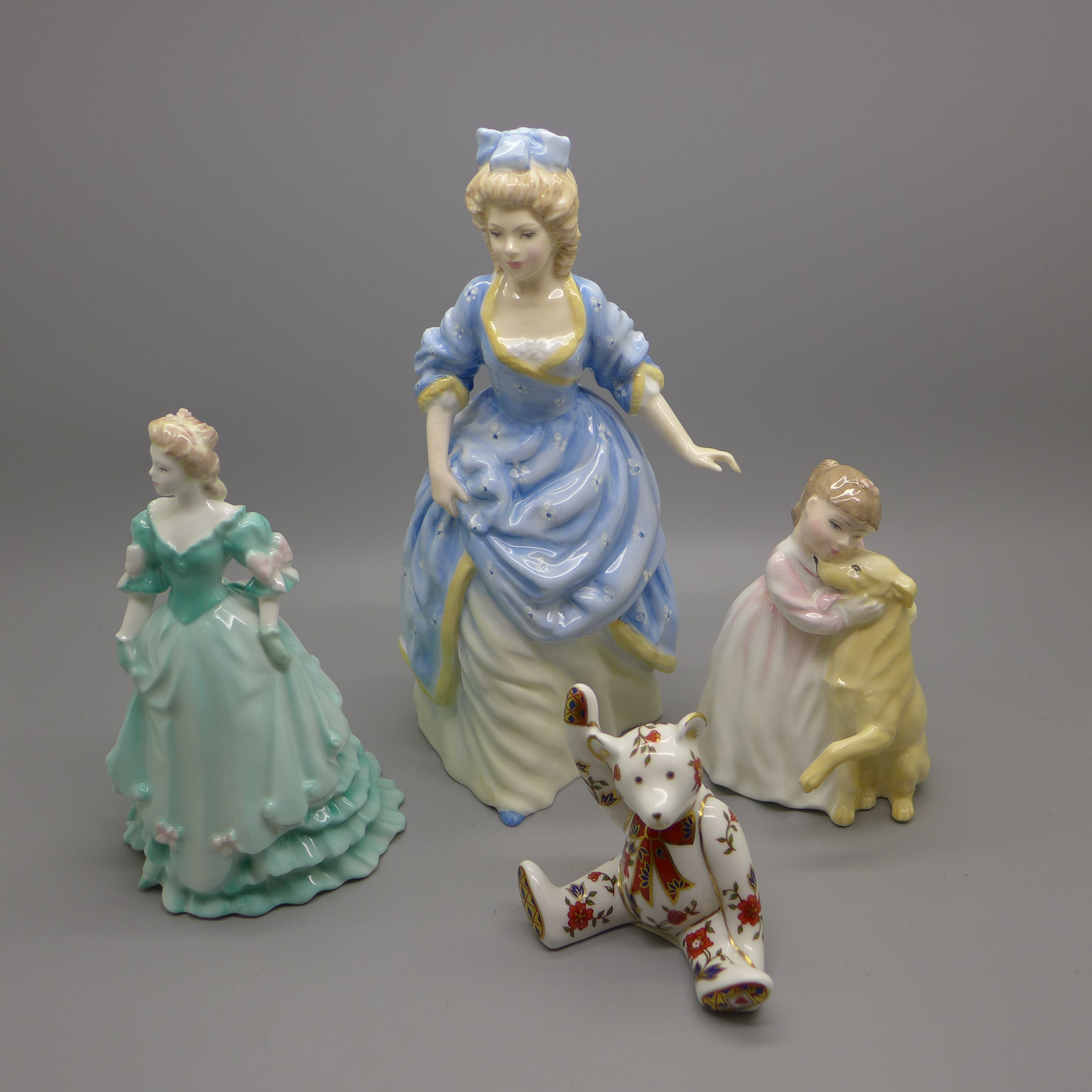 Two Royal Doulton figures, a Coalport figure and a Royal Crown Derby Teddy bear paperweight