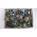 A collection of metal toy soldiers