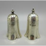 A pair of silver peppers by Horace Woodward & Co. Ltd., London 1903, 60g