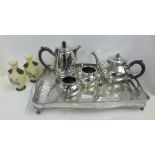 A collection of silver plated items including a tray, a teapot, cream and sugar, a Walker & Hall