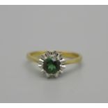 An 18ct gold and green stone ring, 2.7g, K