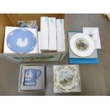 A collection of Wedgwood and Coalport Christmas plates and a Wedgwood mug **PLEASE NOTE THIS LOT