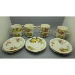 Eight Brexton Pottery cups and saucers decorated with flowers