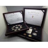 Two cases of coins; The Princess Charlotte Coin Set and Mary Gillick Portrait Set