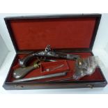 A French flintlock pistol, a 19th Century pocket pistol, spare parts and accessories, cased