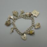 A silver charm bracelet, 47g