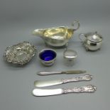 A pierced silver dish, a silver sauce boat, a silver mustard and a silver pot, total weight 182g,