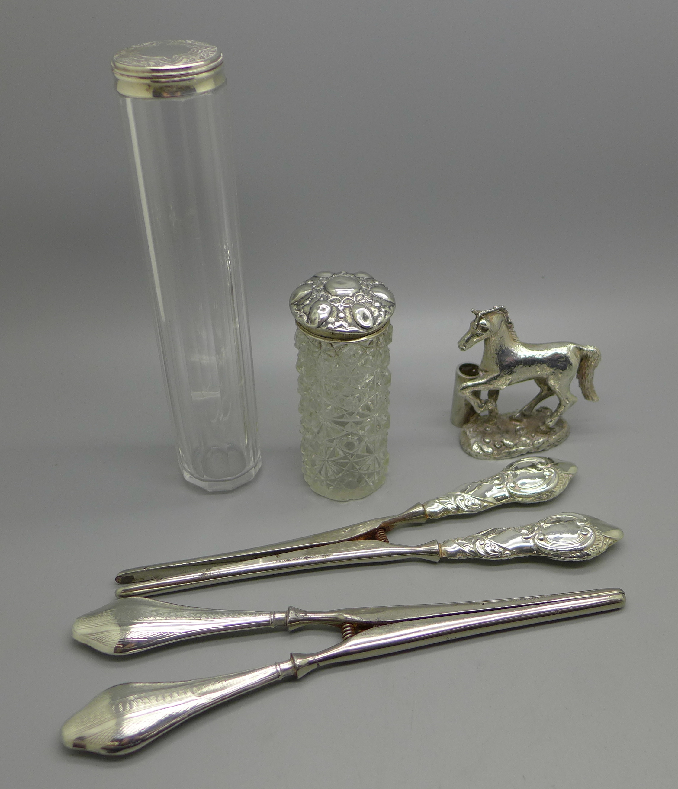 Two silver topped glass jars, one top a/f, two pairs of silver handled glove stretchers and horse