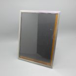 A silver engine turned photograph frame, height 20.5cm