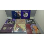 Eight commemorative coin sets including The Royal Mint